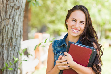 Attractive Smiling Mixed Race Young Girl Student with School Books Outdoors