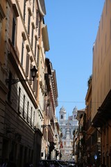 Fototapeta na wymiar Via Condotti leads to Spanish stairs at Piazza di Spagna in Rome, Italy 