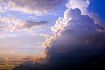 Beautiful blazing scenery of the sunset over the sea and the orange sky above him with amazing Golden reflection of the sun on the calm waves in the background.