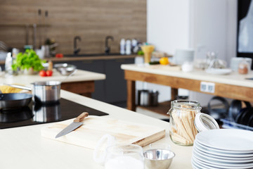 Modern workplace of cooking show: kitchen counter with cutting board