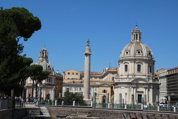 Fototapeta na wymiar Trajan's Column and Santissimo Nome di Maria al Foro Traiano in Rome, Italy 