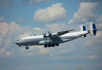 Fototapeta na wymiar Soviet large transport airplane in the summer sky