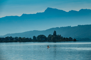 Water sports on the shores of the Upper Zurich Lake, near the historical village of BussKirch, Rapperswil-Jona, Sankt Gallen, Swizerland