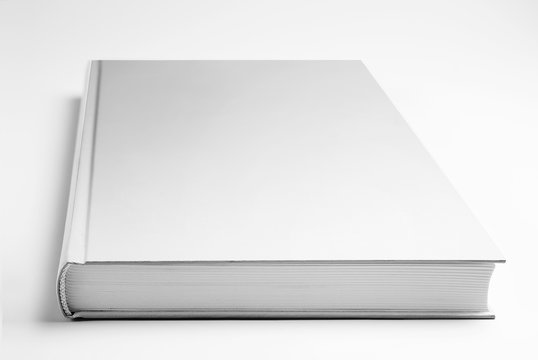 Blank closed book over gray background