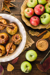 Baked Apples on a Wooden Background Cinnamon Anise and Autumn Leaves