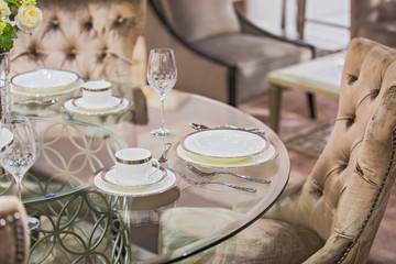 Beautiful luxury serving tableware set. Expensive service in the interior