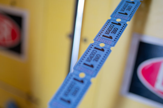 Line Of Tickets From Arcade Game Center Showing One Coupon.