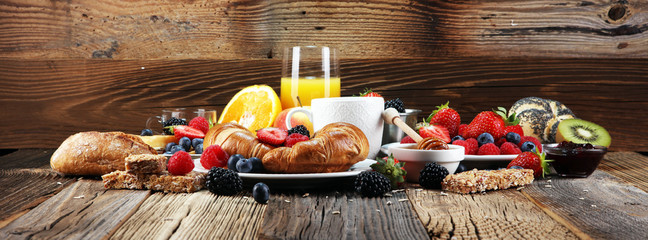 breakfast on table with waffles, croissants, coffe and juice. - obrazy, fototapety, plakaty