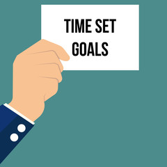 Man showing paper TIME SET GOALS 