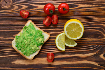 Avocado sandwich on a bread made with fresh sliced avocados from above