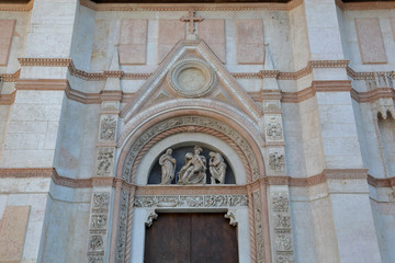BOLOGNA, ITALY - JULY 20, 2018: Facade of the Basilica of San Petronio in Piazza Maggiore. The sixth largest church in Europe. The building was laid in 1390
