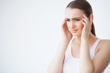 Fototapeta premium Pain. Portrait of a Young Woman Has a Headache