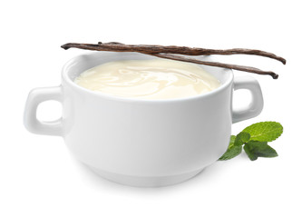 Vanilla pudding, sticks and fresh mint on white background