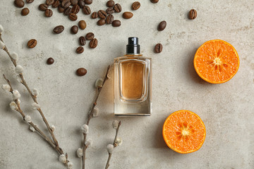 Beautiful composition with bottle of perfume on light background, flat lay
