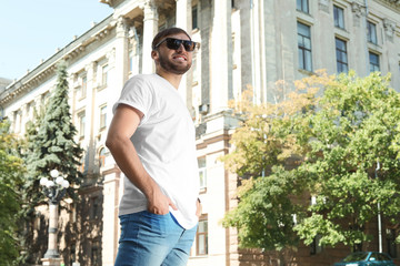 Fototapeta premium Young man wearing white t-shirt on street