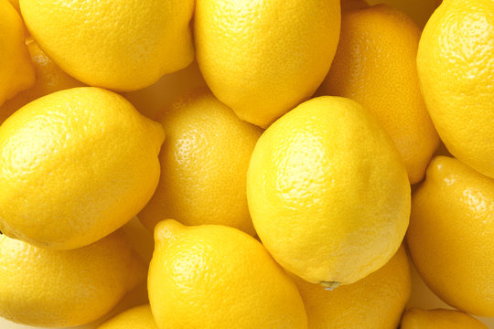 Many fresh ripe lemons as background