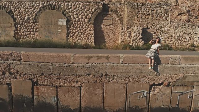 Woman relaxing on parapet