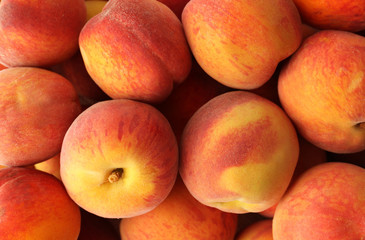 Fototapeta na wymiar Fresh sweet ripe peaches as background