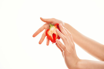half pepper in hand on isolated background vegetable