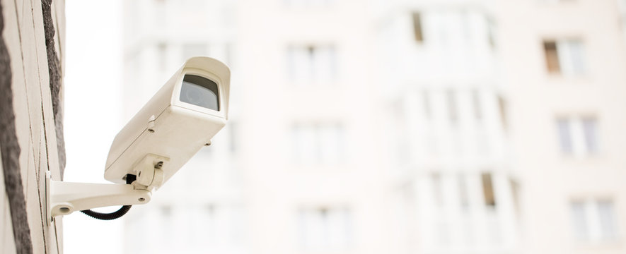 Surveillance camera on wall