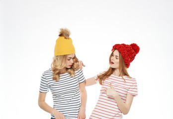 girlfriends in caps on an isolated background