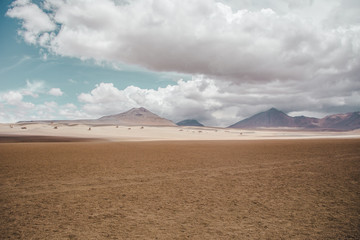Clouds in a blue sky over the Salvador Dali Desert (Desierto de Salvador Dali) in the Eduardo...