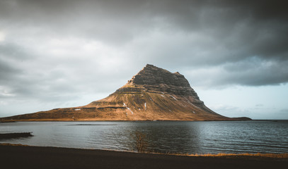 Kirkjufellsfoss and Kirkjufell Icelandic, Church mountain , a 463 m high mountain on the north coast of Iceland's Snaefellsnes peninsula, near the town of Grundarfjordur, Iceland