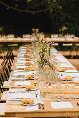 Decoration of the centerpieces of a wedding with the cutlery and vintage details.