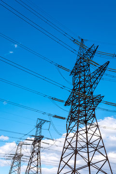  high-voltage  power lines at storm clouds.