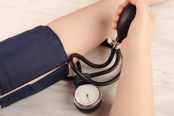 Close up view of person measuring his blood pressure