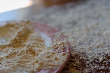Top side view on white flour on rustic wooden table background, closeup of healthy cooking copyspace surface at home or restaurant.