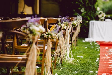 Decorations for a rustic outdoor wedding with natural motifs and flowers.