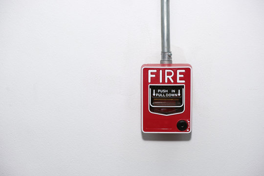 Close up fire alarm notifier on wall