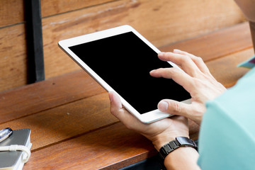 man using tablet computer with blank screen