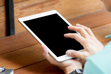 man using tablet computer with blank screen
