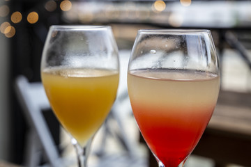 Close-up of two cocktails with different colors