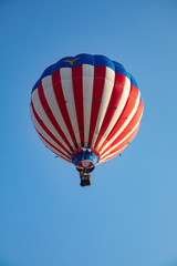 Red White and Blue Hot Air Balloon in Air with Blue Sky