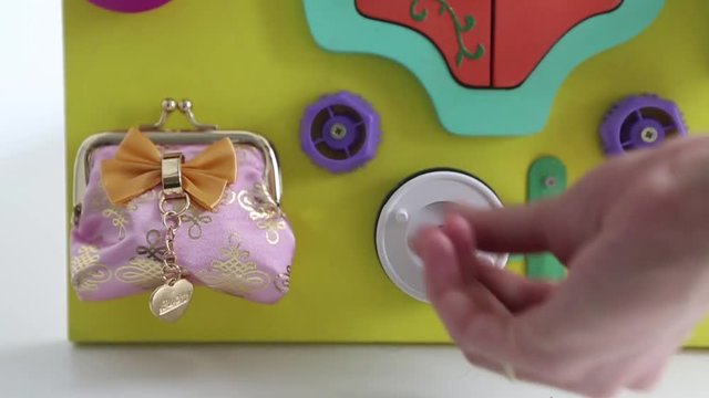 demonstration of torque parts on visibone. Woman playing with children's educational toy