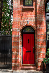 Naklejka premium Front door of an ornate brownstone building in an iconic neighborhood of Brooklyn in New York City