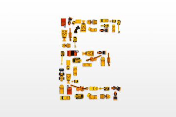 English letters formed by arrangement of Car toy diecast on the white background , Top view