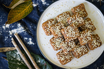 Homemade halva - sweet confections dessert made with tahini (sesame paste) nuts, butter, sunflower seeds, dates, honey, herbs, spices, oil. Vegan sweets. Vegetarian dessert. Arabic Turkish halava