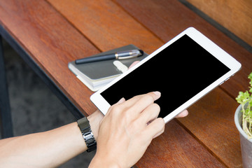 man using tablet computer with blank screen