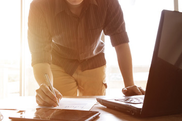 business people analyzing graph and chart document