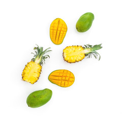Pineapple and mango fruits on white background. Flat lay, top view. Tropical fruit concept.