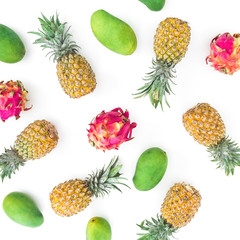 Pineapple, mango and dragon fruit on white background. Flat lay, top view. Food background.