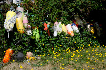 House Fence decorated with lobster buoys