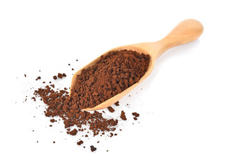 Coffee powder in spoon on white background