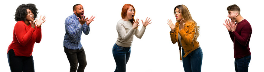 Group of cool people, woman and man stressful keeping hands on head, terrified in panic, shouting