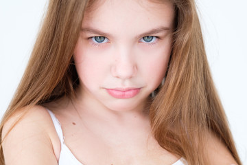emotion face. capricious hurt offended child with pursed lips. little girl portrait on white...