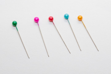 Isolated pin needles on white background